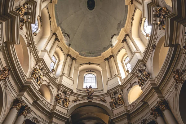 The interior of the old church with gold molding, inside view.