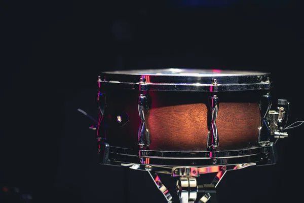 Snare drum on a black background, musical instrument, musical concept.