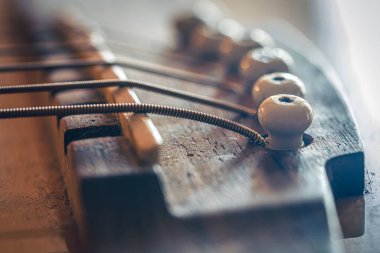 Strings on a classical acoustic guitar, macro shot.