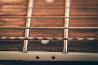 Strings on a classical acoustic guitar, macro shot.