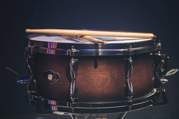 Snare drum on a black background, musical instrument, musical concept.