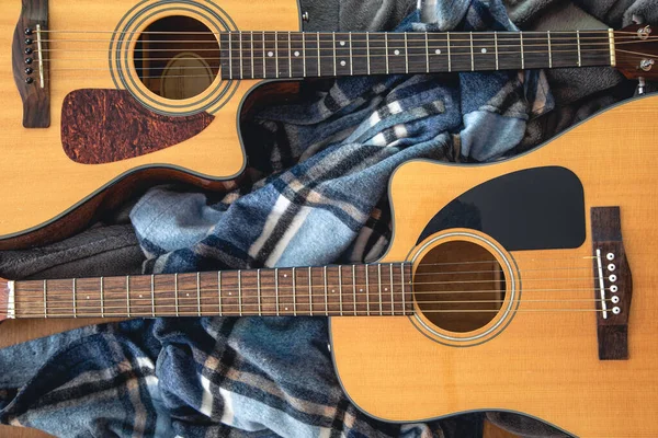 Two Acoustic Guitars Close Cozy Plaid Top View — Fotografia de Stock