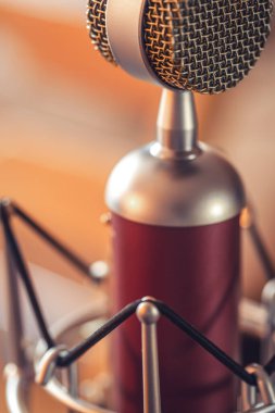 Professional microphone for sound recording, macro photography, musical creativity concept.