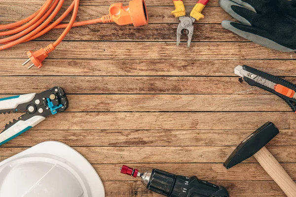 Flat lay, set of construction hardware tools building, repair accessories on wooden board background.