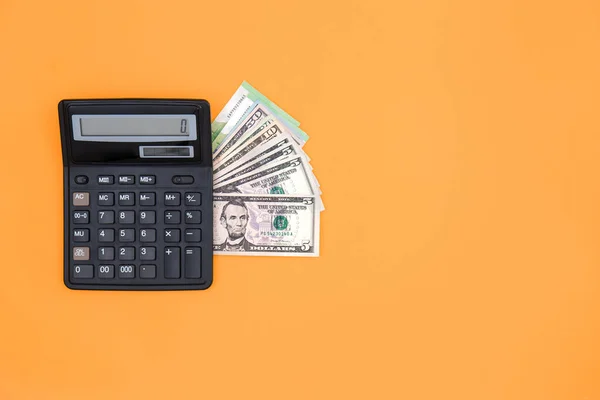 Calcolatrice Dollari Uno Sfondo Arancione Concetto Pianificazione Bilancio Fare Soldi — Foto Stock