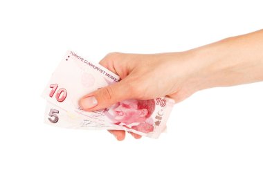 Elinde Türk parası, beyaza izole edilmiş.