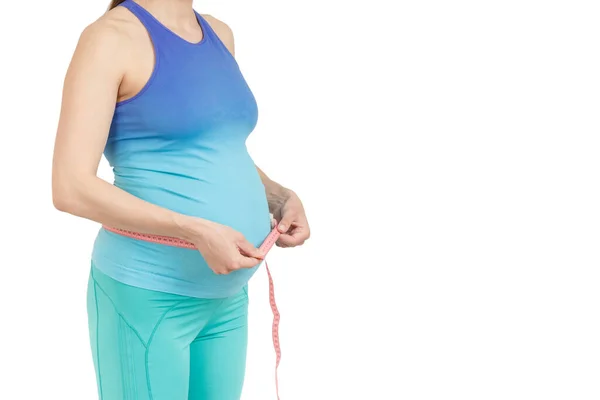 Sportowy Kobieta Ciąży Ręce Brzuchu Białym Tle — Zdjęcie stockowe