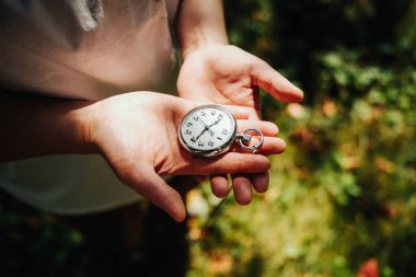 pocket watch on woman hand