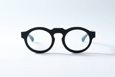 eyeglass on white background paper
