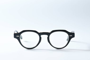 eyeglass on white background paper