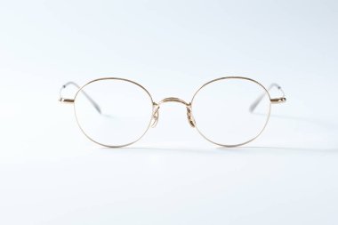 eyeglass on white background paper