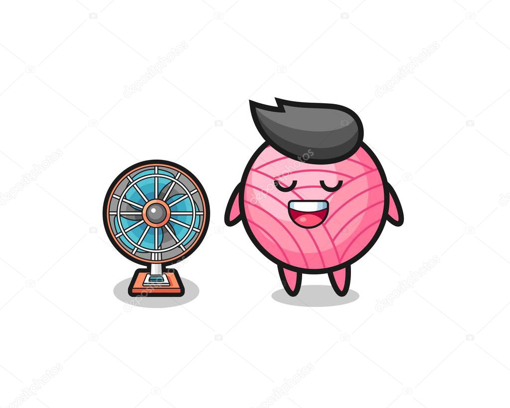 cute yarn ball is standing in front of the fan , cute design