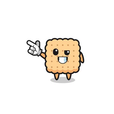 Kraker maskotu sol üst tarafı işaret ediyor, şirin tasarım.