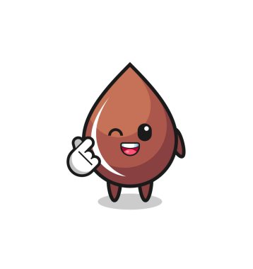 Çikolata damlası karakteri Korece parmak kalbi yapıyor, şirin tasarım.