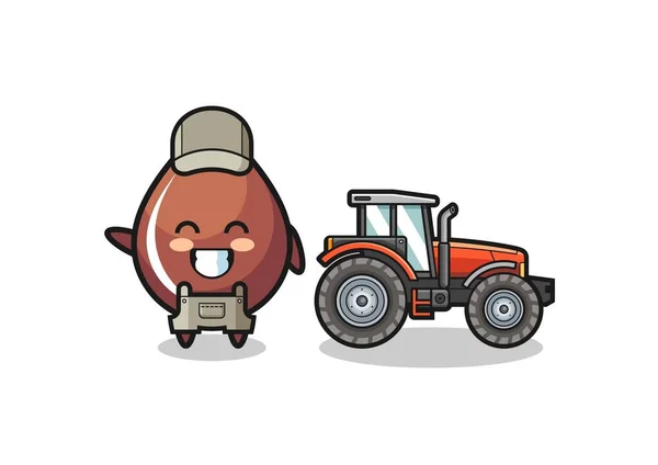 トラクターの横に立つチョコレートドロップ農家のマスコット — ストックベクタ