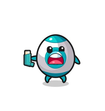 Roket maskotunun astımı var. Astım spreyini tutarken, şirin bir tasarım.