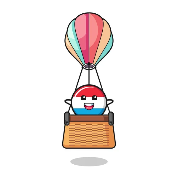 熱気球に乗るルクセンブルクのマスコット かわいいデザイン — ストックベクタ