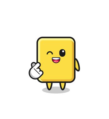yellow card character doing Korean finger heart , cute design