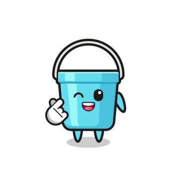 plastic bucket character doing Korean finger hear