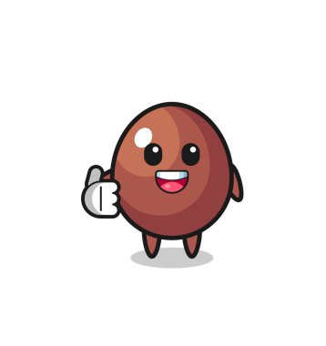 chocolate egg mascot doing thumbs up gesture , cute design