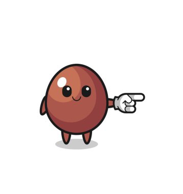 chocolate egg mascot with pointing right gesture , cute design