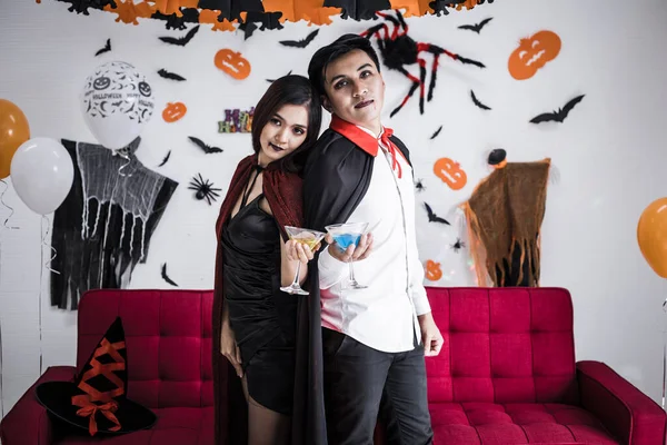 Young Asian Couple Costume Witch Dracula Celebrate Halloween Party Drink — стоковое фото