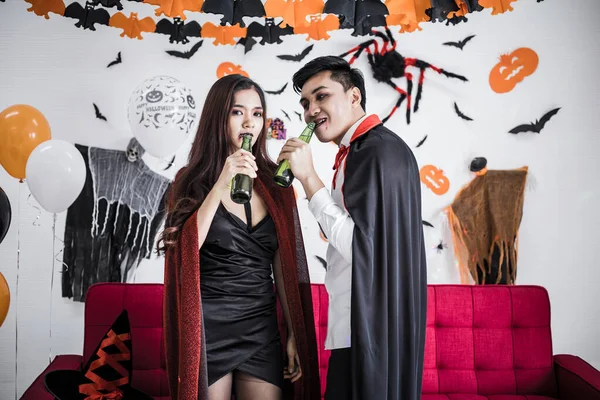 Young Asian Couple Costume Witch Dracula Celebrate Halloween Party Drink — стокове фото