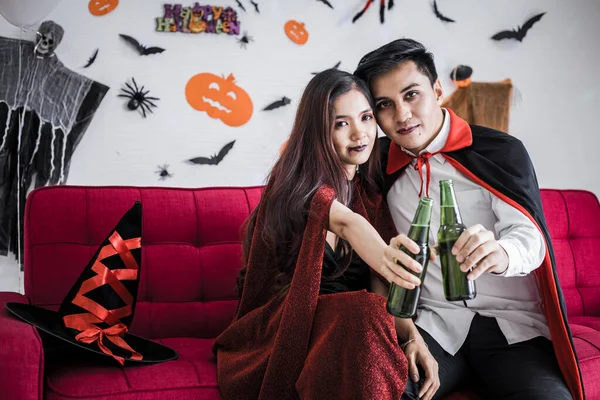 Young Asian Couple Costume Witch Dracula Celebrate Halloween Party Drink — стоковое фото