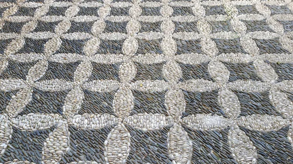 西班牙安达卢西亚科尔多瓦用圆圆的河床卵石铺成的鹅卵石路面 背景纹理 Patio Andaluz — 图库照片