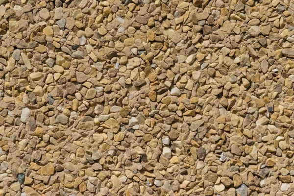 Textur Steinmauer Wandverkleidung kleine Stücke verschiedene Steine — Stockfoto