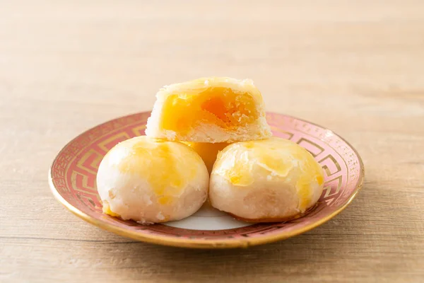 Chinese pastry moon cake with salted egg peanut or Spring Roll pastry with nuts and salted eggs - Asian food style