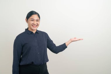 Asian woman with hand pointing on wall
