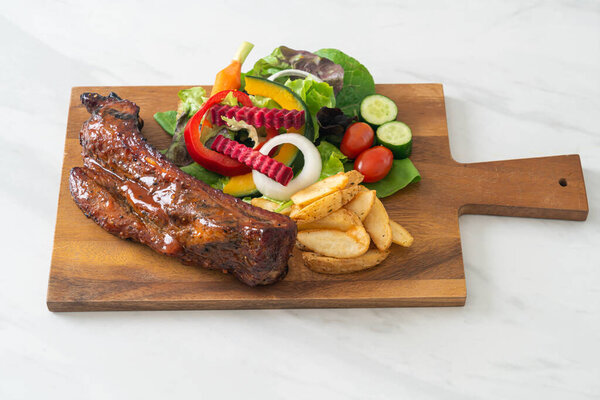 grill barbecue pork spare ribs with vegetables