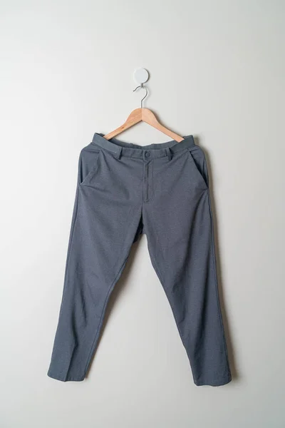 Pantalones Pantalones Largos Colgados Con Percha Madera Pared —  Fotos de Stock