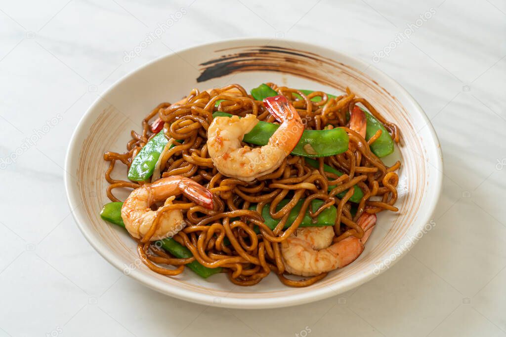 stir-fried yakisoba noodles with green peas and shrimps - Asian food style