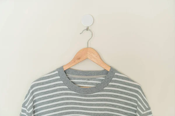 Grey Shirt Hanging Wood Hanger Wall – stockfoto