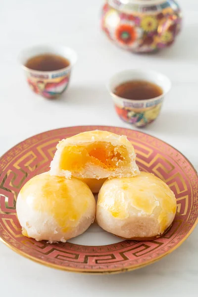 Chinese pastry moon cake with salted egg peanut or Spring Roll pastry with nuts and salted eggs - Asian food style