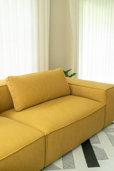 empty yellow fabric sofa decoration interior in living room at home