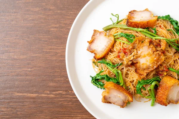 Stir-fried rice vermicelli and water mimosa with crispy pork belly - Asian food style