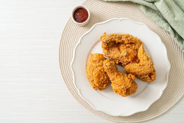 fried chicken with ketchup on plate - unhealthy food