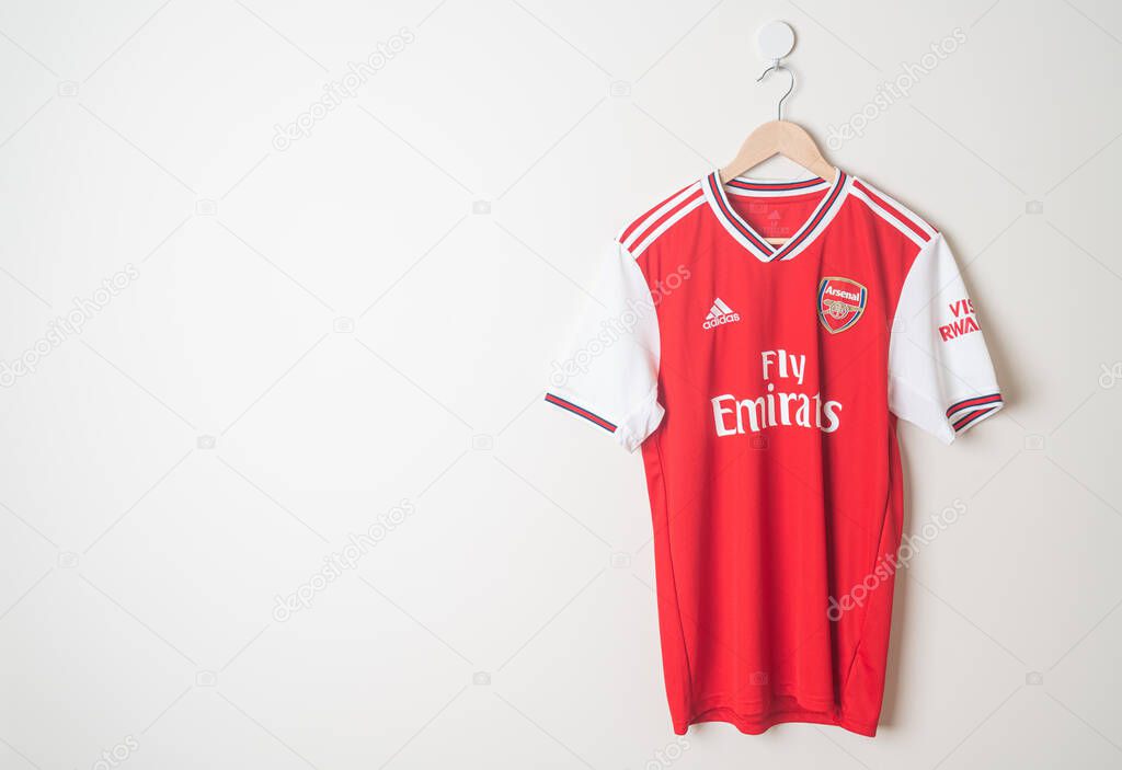 Bangkok, Thailand - Jan 18, 2022 : Arsenal retro shirt home jersey season 2019-2020 hanging on wall