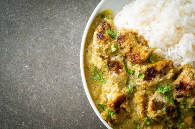 Afghani chicken in green curry or Hariyali tikka chicken hara masala with rice - Asian food style