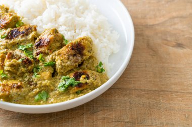 Afghani chicken in green curry or Hariyali tikka chicken hara masala with rice - Asian food style