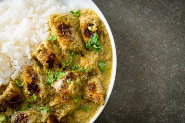 Afghani chicken in green curry or Hariyali tikka chicken hara masala with rice - Asian food style