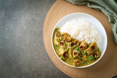 Afghani chicken in green curry or Hariyali tikka chicken hara masala with rice - Asian food style