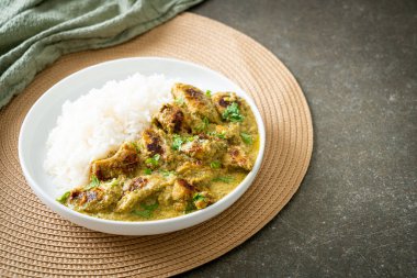 Afghani chicken in green curry or Hariyali tikka chicken hara masala with rice - Asian food style