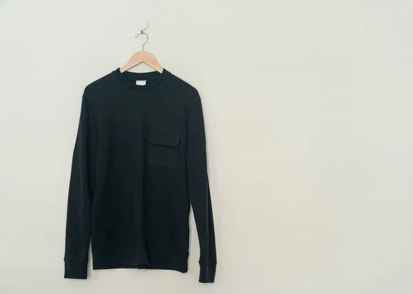Black Sweater Hanging Wood Hanger Wall — Photo