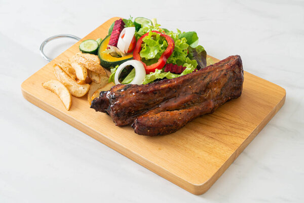 grill barbecue pork spare ribs with vegetables