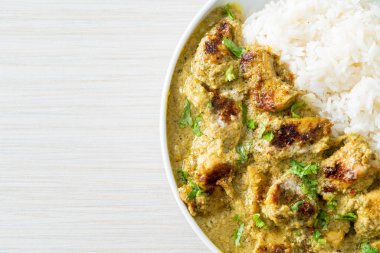 Afghani chicken in green curry or Hariyali tikka chicken hara masala with rice - Asian food style