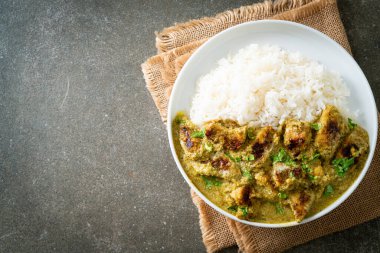 Afghani chicken in green curry or Hariyali tikka chicken hara masala with rice - Asian food style